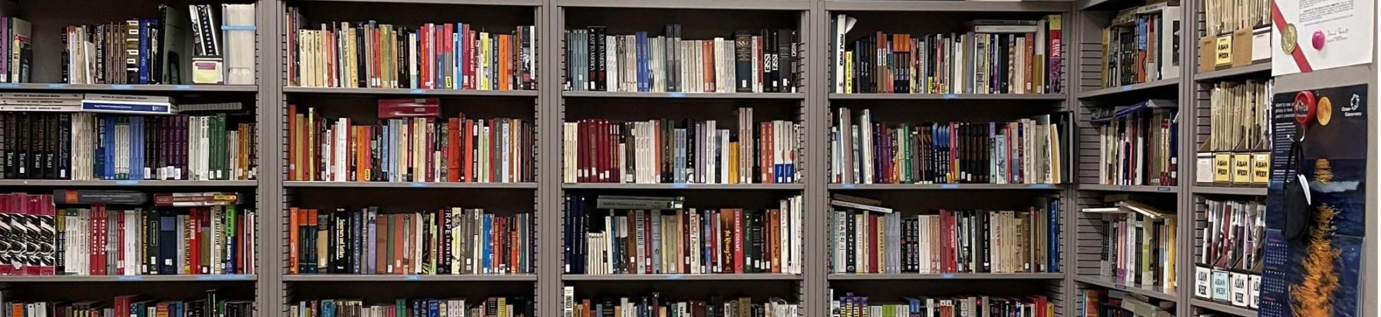 George Kagiwada library bookshelves and posters